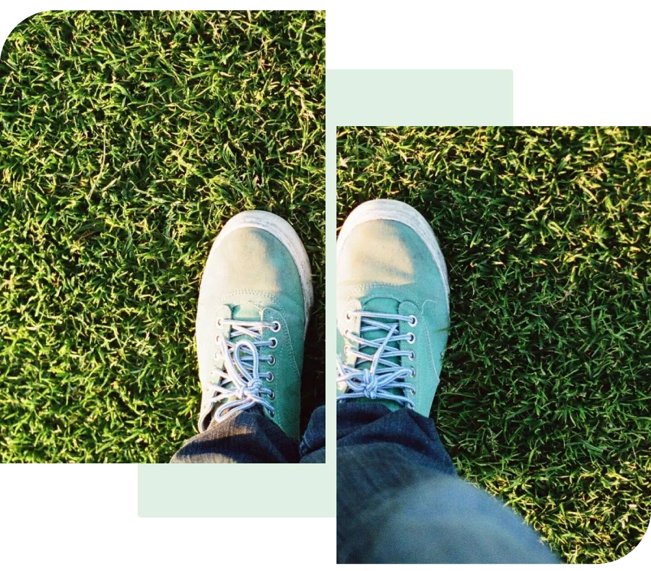 A person standing on top of a grass covered field.